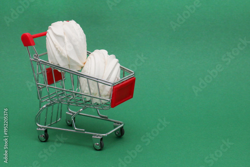 Mini shopping cart holds two fluffy meringues