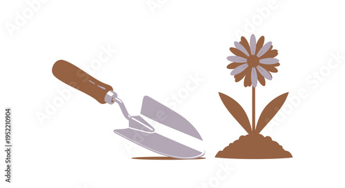 Trowel next to a flower plant.