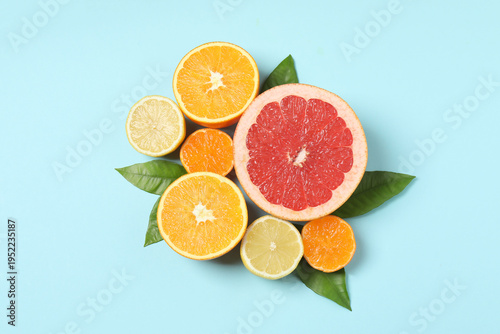 Citrus fruits, including grapefruit, lemon, orange. The concept of a source of fresh vitamin C, increasing immunity, removing toxins, natural healthy lifestyle, organic fruits. on a blue background