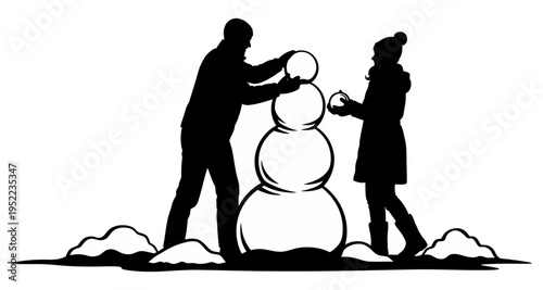 Silhouette of father and child building snowman together in winter snow family fun