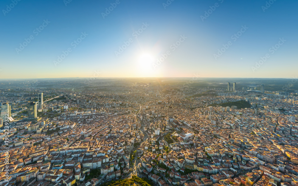 Fototapeta premium Istanbul, Turkey. Panoramic aerial drone view of European city center skyline with modern skyscrapers at sunset, clear sky, urban landscape. Aerial view