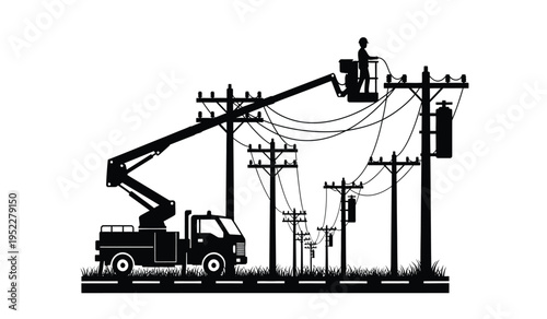 A silhouette of a utility worker performing maintenance on power lines using a bucket truck crane