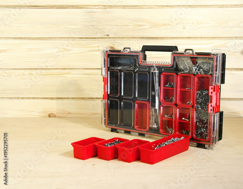 Red plastic organizer with fasteners. Professional organizer. Red plastic with fasteners.