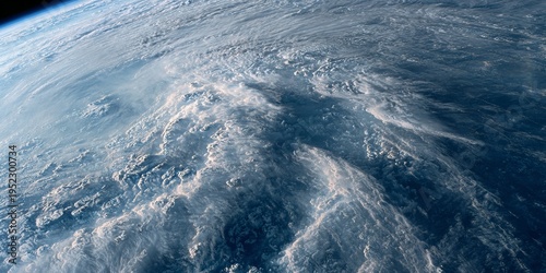 Wallpaper Mural A high-altitude shot showcasing Earth's atmosphere. Swirling cloud formations dominate the landscape, with a gradient of blues and whites Torontodigital.ca