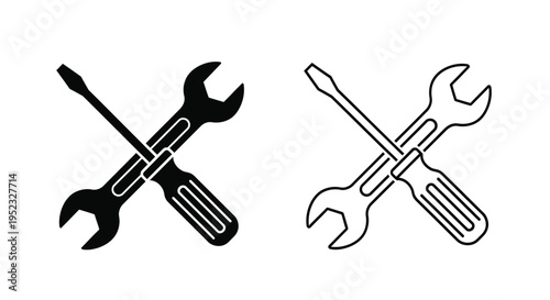 Two sets of crossed tools a screwdriver and an adjustable wrench