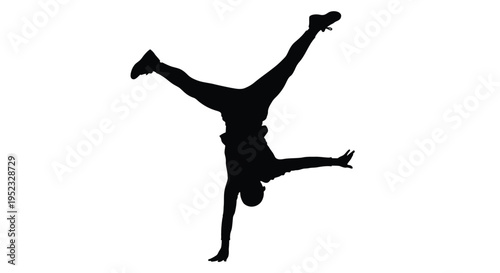 Silhouette of a person performing a dynamic handstand in mid air