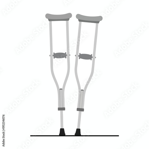 Pair of adjustable crutches stand upright, ready for use on a horizontal line