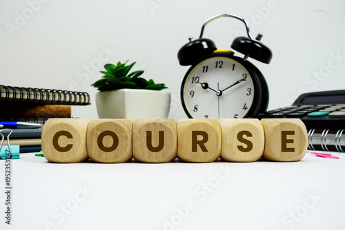 Fotografie COURSE alphabet letters with alarm clock and calculator on white background