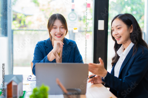 Two businesswoman hands or accountants working together on financial investment on calculator, calculating, analyzing business growth and marketing on graph.