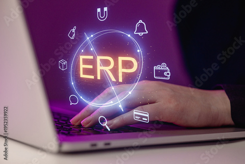 Fotografi Focus on enterprise resource planning software on a laptop with digital icons in