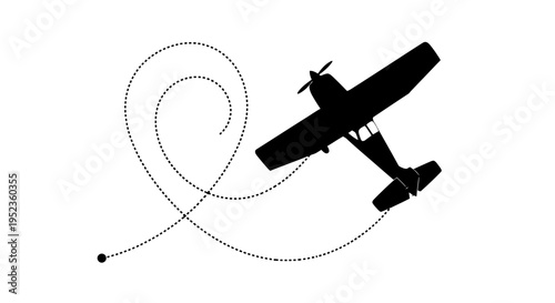 An airplane performs an aerobatic stunt with smoke trails in clear blue sky