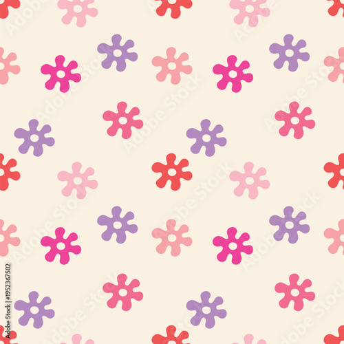 Seamless pattern with pink and purple daisy flowers on a light background