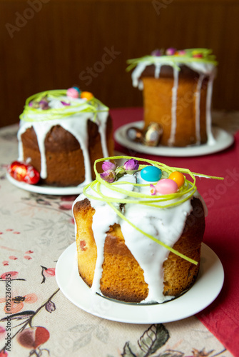 Easter cake with eggs on a plate is on the table