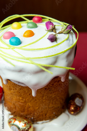 Easter cake with eggs on a plate is on the table