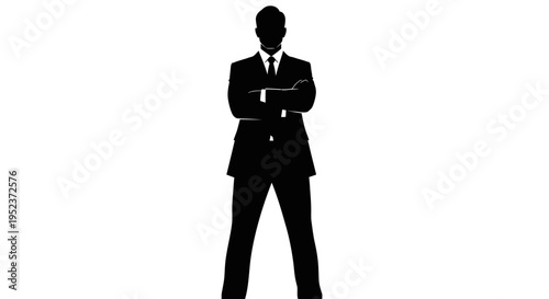 Silhouette of a confident businessman in a suit with arms crossed, professional and powerful stance