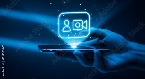 A hand holding a smartphone with a glowing blue video call icon