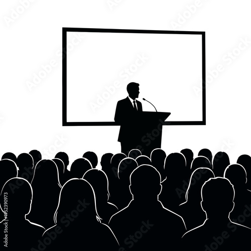 Man Speaking at Podium to Audience.