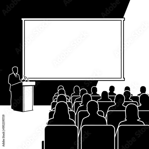 Man Presenting to Audience in Auditorium.