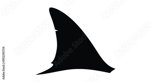 Black shark fin cutting through water a dramatic silhouette