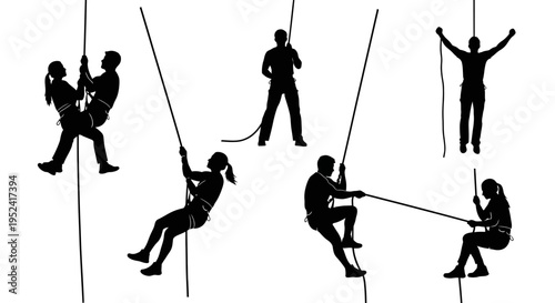 Silhouette climbers rappelling and climbing rock wall with ropes, active lifestyle and extreme sports concept