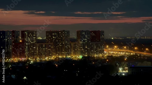 Wallpaper Mural Breathtaking timelapse of Moscow city skyline at night. Illuminated residential buildings and highway traffic under changing evening sky. Dynamic urban landscape, city lights, modern architecture. Torontodigital.ca