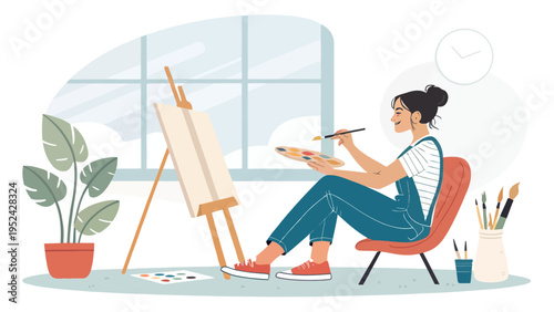 Relaxed female artist painting on canvas in a cozy studio with plants and natural light