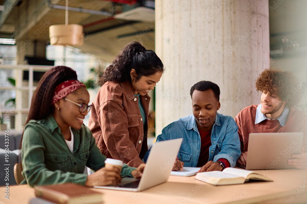 Obraz premium Happy multiracial friends learning together at university.
