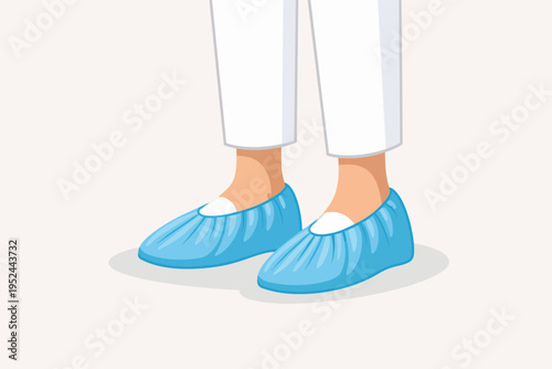 Feet wearing protective blue disposable shoe covers over shoes, promoting hygiene and protecting against contamination