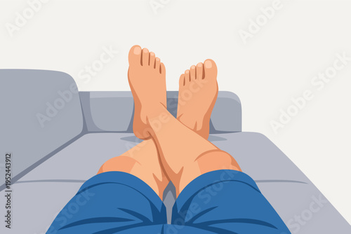 Relaxing at home, person enjoying leisure time on a couch with bare feet up. Comfort and relaxation concept