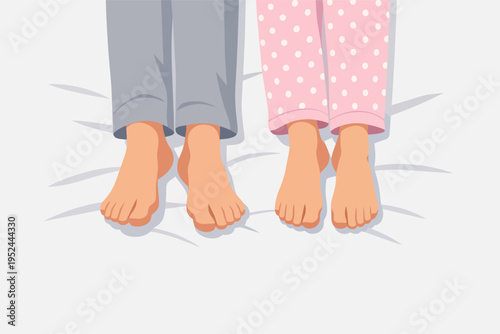 Couple feet wearing pajamas in bed, sleeping and relaxing together, comfortable morning at home, top view