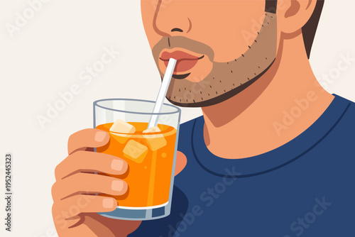 Man drinking orange juice with ice and straw, enjoying a healthy refreshment and hydrating himself