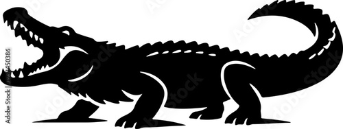 A large crocodile roars with open mouth and sharp teeth on land