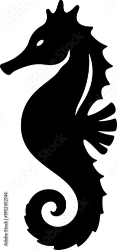 A black silhouette of a seahorse swims in the ocean water.