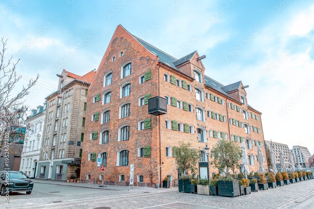 Fototapeta premium Historic Red Brick Warehouse Building in Nyhavn Copenhagen Denmark