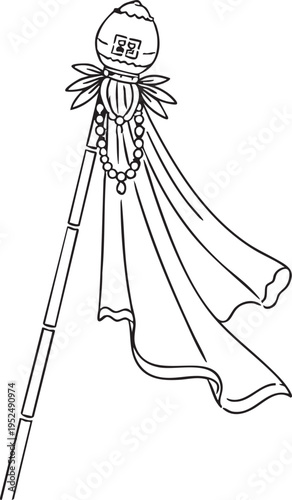 Traditional asian ceremonial staff with decorative elements and flowing cape