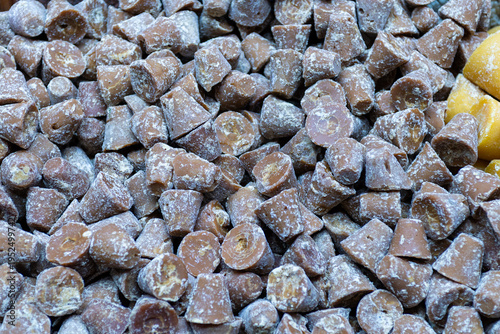 Photos Close-up Shot of Piloncillo Traditional Unrefined Sugar Cones Pile in Market