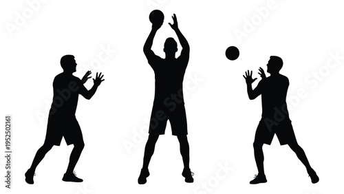 Silhouette of three men playing volleyball