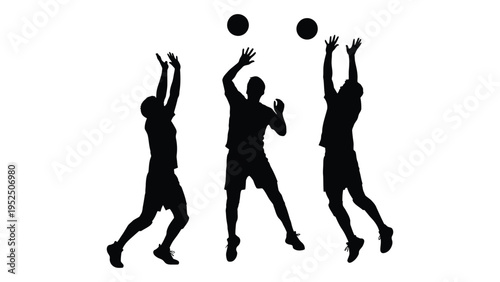 Three volleyball players jumping to hit a ball
