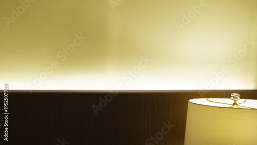 Tableau sur toile Minimalist Bedroom with Indirect Headboard Lighting and Modern Table Lamp