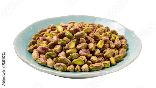 Isolated shot of fresh unshelled and shelled pistachios in a blue plate, healthy snack food