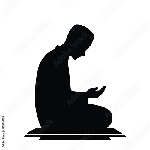 Silhouette of a person kneeling and praying on a prayer mat, a symbol of devotion and faith