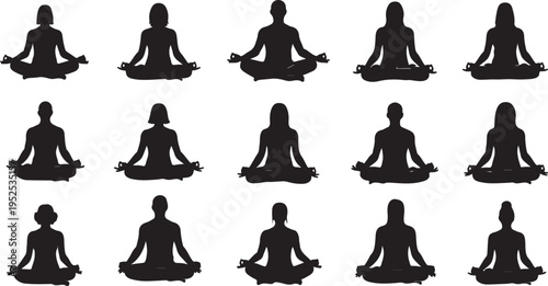 Silhouette of multiple people meditating in yoga poses together