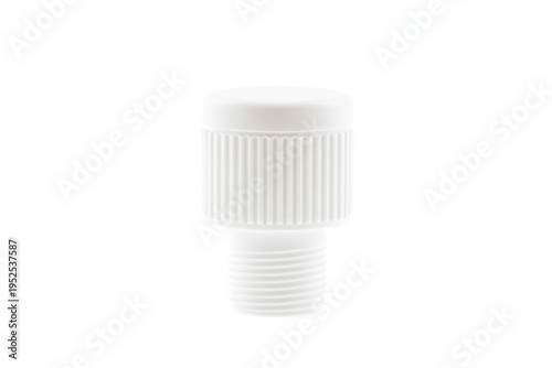 White plastic threaded bottle cap with vertical ribbed grip texture isolated on a white background