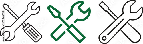 Essential Tools: A close-up shot of three crossed wrenches and screwdrivers, perfect for illustrating repair, construction, and mechanical concepts. 