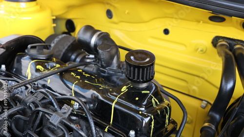 Принти на полотні Close up of a custom modified car engine featuring a black valve cover with yell