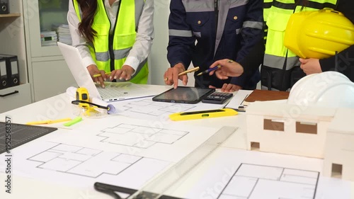 brainstorming and measuring for cost estimating on paperworks and floor plan drawings about design architectural and engineering for houses and buildings.