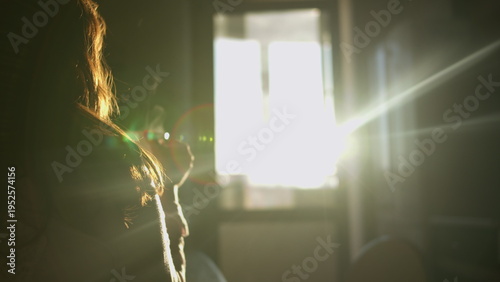 Photos Woman Relaxing Near Bright Window with Sunlight, have fun and enjoy
