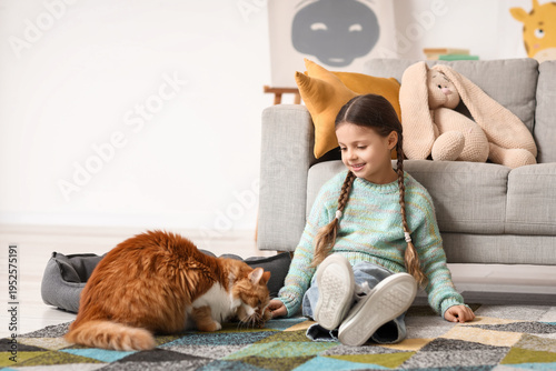 Cute little girl playing wi...