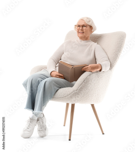 Senior woman reading book i...