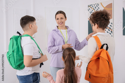 Female guide showing painti...